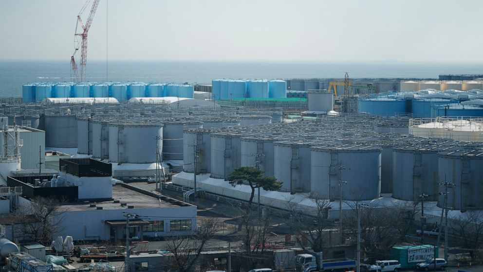 Tanks storing treated radioactive water after it was used to cool the melted fuel are seen at the Fukushima Daiichi nuclear power plant, run by Tokyo Electric Power Company Holdings (TEPCO), in Okuma town, northeastern Japan, Thursday, March 3, 2022.