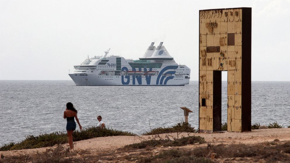 The GNV Rhapsody ferry is moored off the coast of Lampedusa island, Italy, Friday, Sept. 4 , 2020. Italian officials have been hastily chartered ferries and put other measures into place to fight severe overcrowding at migrant centers on the tiny isl
