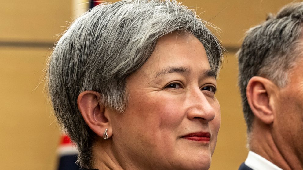 FILE - Australia's Foreign Minister Penny Wong, with Defense Minister Richard Marles, partly seen at right, visit the Japanese prime minister's office during their visit to Tokyo, Dec. 9, 2022. Australia’s foreign minister is in China for talks seeki
