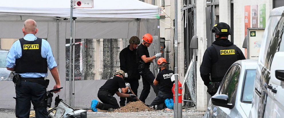 Danish police technicians inspect the scene outside of a local police station in Copenhagen, Saturday, Aug. 10, 2019, after it was hit by an explosion early morning, causing damage but no injuries. This follows-on from Tuesdays explosion which occur