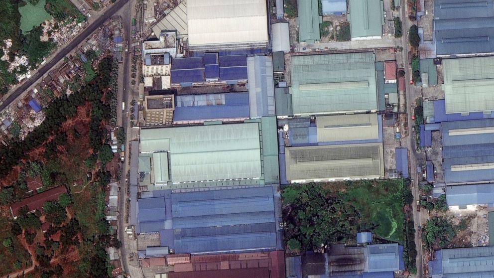 This combination image of March 9, 2021, top, and March 15, 2021, satellite images provided Maxar Technologies shows Global Fashion Garment Factory, a Chinese-owned supplier to the fashion retailer C&A, in Yangon, Myanmar. Confusion over what exactly