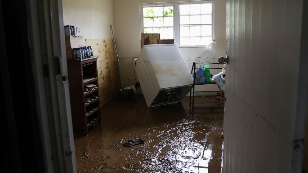 Mud covers the floor of a home flooded by Hurricane Fiona in Cayey, Puerto Rico, Tuesday, Sept. 20, 2022. Fiona hit Puerto Rico’s southwest corner on Sunday. (AP Photo/Stephanie Rojas)