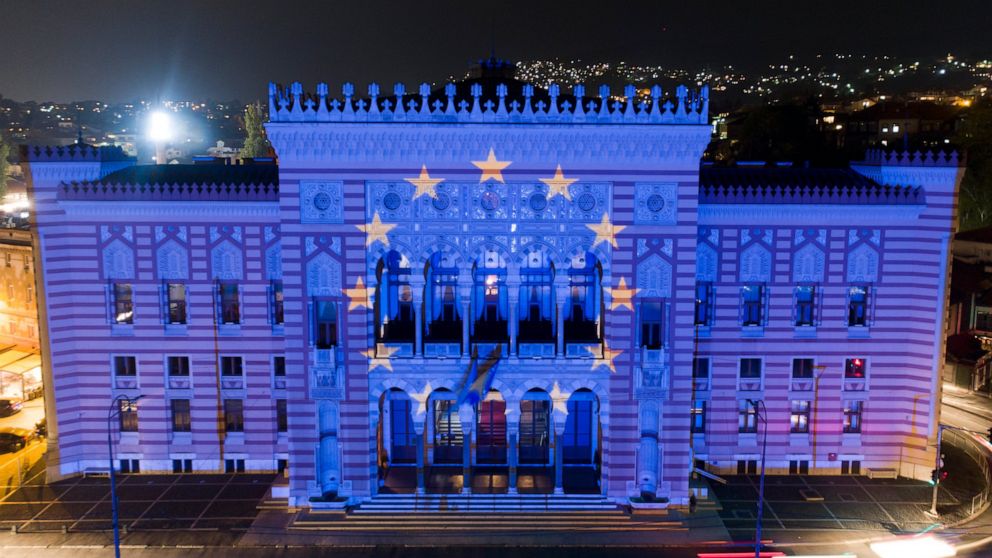 FILE - The European Union flag is projected on the National Library building in Sarajevo, Bosnia, on Oct. 12, 2022. The war in Ukraine has put the European Union's expansion at the top of the agenda as officials from the Western Balkans and EU leader
