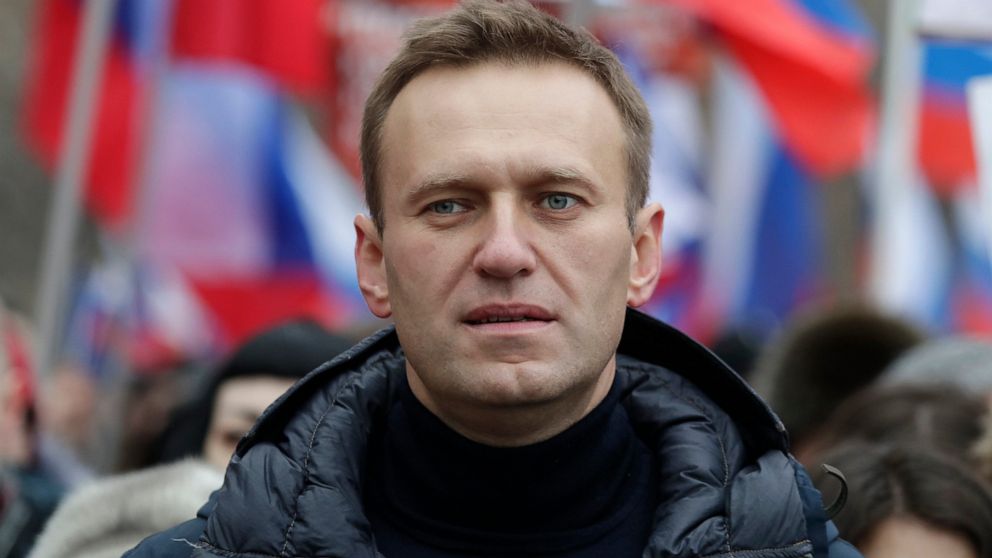 FILE - In this Sunday, Feb. 24, 2019 file photo, Russian opposition activist Alexei Navalny takes part in a march in memory of opposition leader Boris Nemtsov in Moscow, Russia. Russian opposition politician Alexei Navalny was placed on a ventilator 