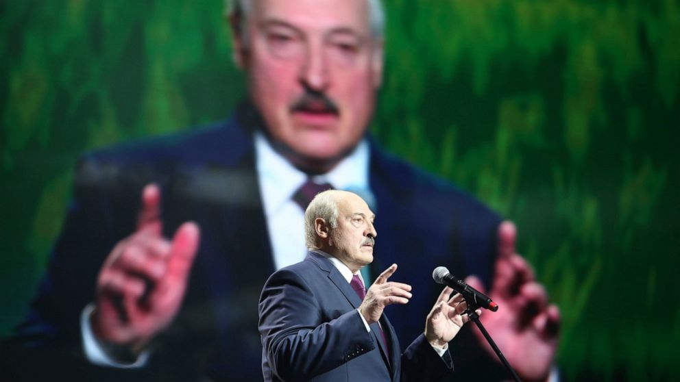 Belarusian President Alexander Lukashenko gestures as he addresses a women's forum in Minsk, Belarus, Thursday, Sept. 17, 2020. President Alexander Lukashenko's decision to close the borders with Poland and Lithuania underlines his repeated claim tha