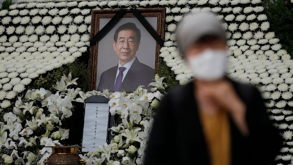 A mourner passes by a memorial altar for late Seoul Mayor Park Won-soon at City Hall Plaza in Seoul, South Korea, Monday, July 13, 2020. Mayor Park was found dead in wooded hill in northern Seoul on Friday after massive police searches for him. (AP P