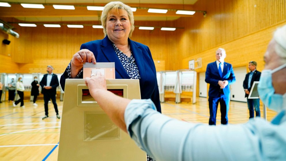 Norway's Prime Minister Erna Solberg, leader of the The Conservative Party Hoyre, casts her ballot in the 2021 parliamentary elections, at Skjold School in Bergen, Norway, Monday, Sept. 13, 2021. Norwegians are heading to the polls on Monday with the