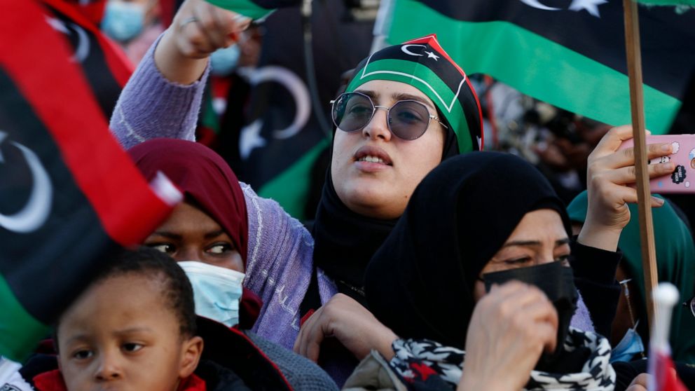 FILE - Libyans celebrate February Revolution Day in Martyrs' Square in Tripoli, Libya, Feb. 18, 2022. Two separate governments are once again vying for power in Libya. It's the latest setback, reversing tentative steps toward unity in the past year, 