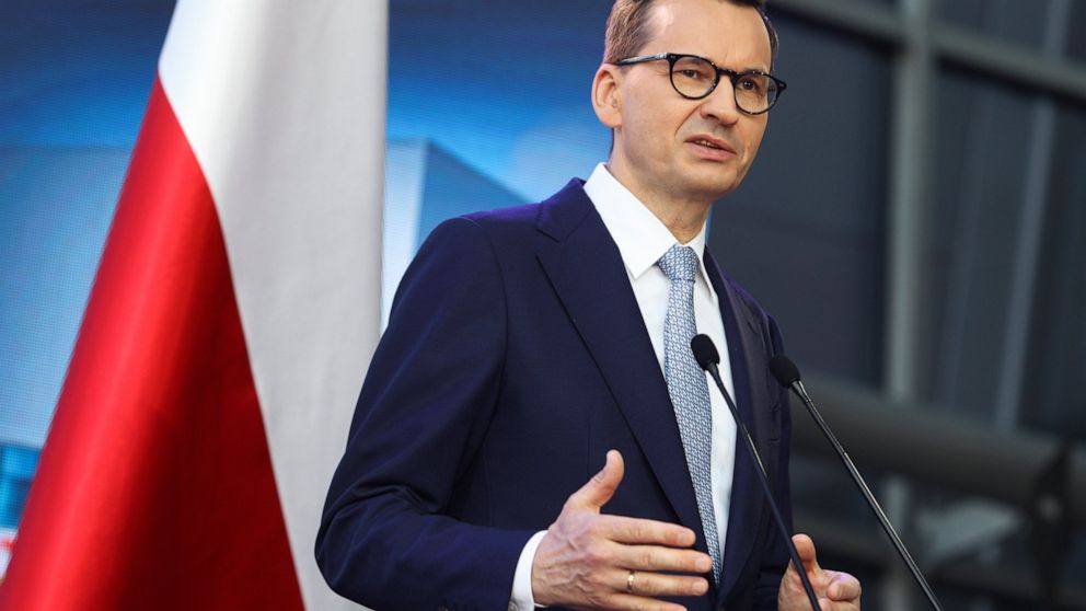Poland's Prime Minister Mateusz Morawiecki briefs the media during a joint news conference with Polish President Andrzej Duda and European Commission President Ursula von der Leyen at the headquarters of Poland's Power Grid in Konstancin-Jeziorna, Po
