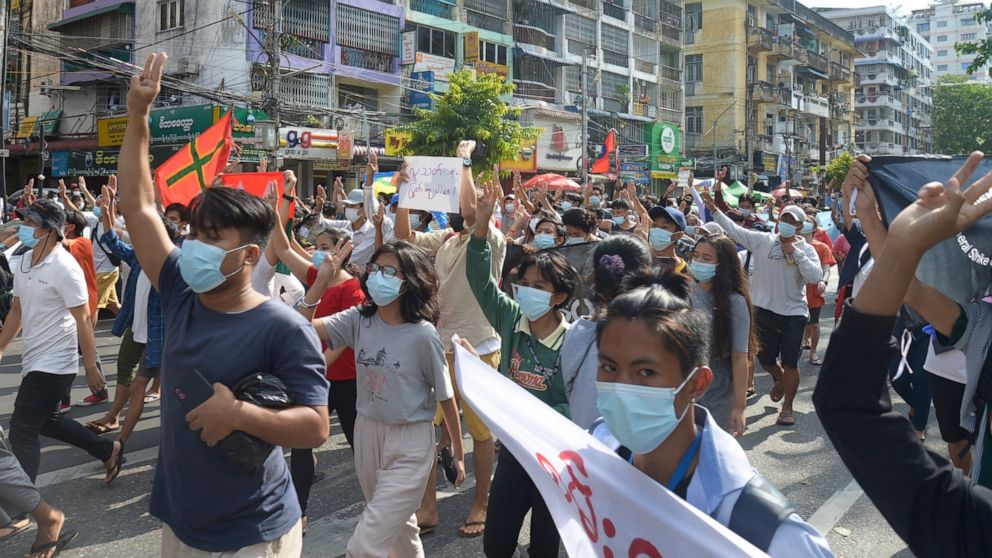 Flash mobs in Myanmar's biggest city avoid deadly response