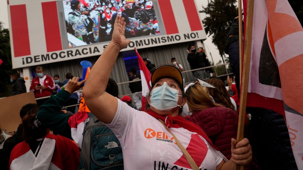 Supporters of presidential candidate Keiko Fujimori gather to protest alleged election fraud in Lima, Peru, Saturday, June 12, 2021. Supporters are hoping to reverse the results of the June 6th presidential runoff election that seem to have given the