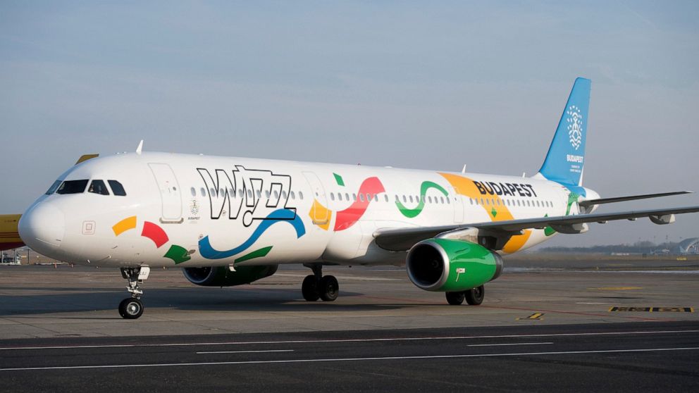 FILE - An aircraft of the low-cost of Wizz Air airlines painted in the colours of the logo of host city candidate Budapest for the 2024 Olympic and Paralympic Games is displayed in Liszt Ferenc International Airport in Budapest, Hungary, Nov. 24, 201