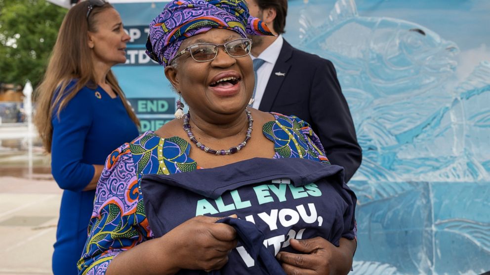 Nigeria's Ngozi Okonjo-Iweala, Director General of the World Trade Organisation (WTO), attends an event on World Ocean Day with Finley the fish, made of ice, on place des Nations before of the World Trade Organization (WTO) Ministerial Conference (MC