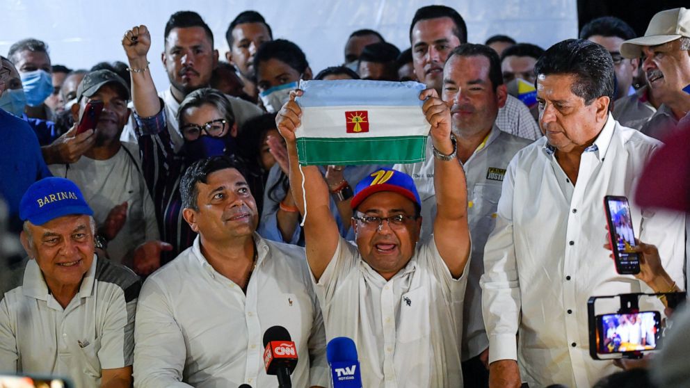 Opposition candidate Sergio Garrido celebrates after ruling party candidate Jorge Arreaza admitted on social media his defeat in a governor election re-run in Barinas, Venezuela, Sunday, Jan. 9, 2022. Voters in the home state of Venezuela's late Pres
