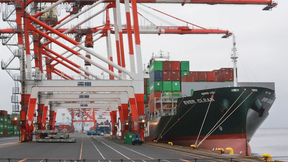 FILE - A container ship is docked at a port in Tokyo, Tuesday, Oct. 12, 2021. Japan’s exports and imports both reached record highs in December because of surging oil prices, as well as a weak yen, the government said Thursday, Jan. 20, 2022. (AP Pho