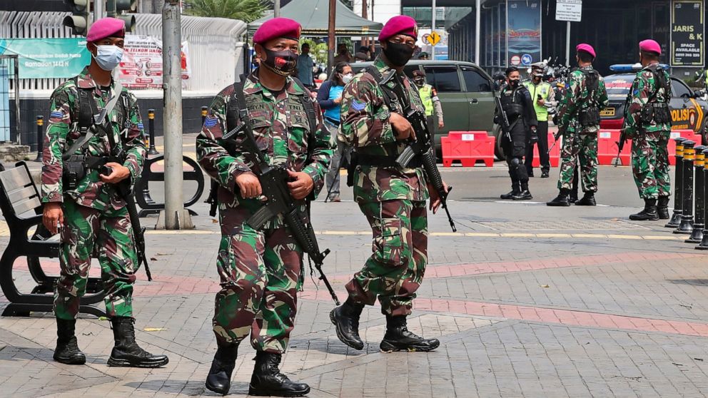 Indonesian marines patrol the street near the Association of Southeast Asian Nations (ASEAN) Secretariat ahead of a leaders' meeting in Jakarta, Indonesia, Saturday, April 24, 2021. Southeast Asian leaders are to meet Myanmar's top general and coup l