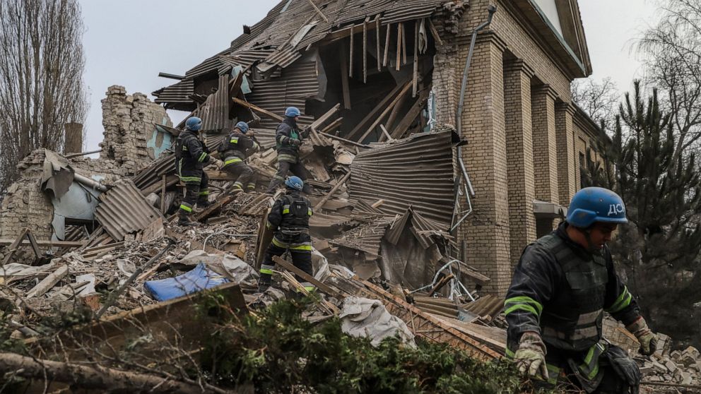 Ukrainian firefighters work at a damaged hospital maternity ward in Vilniansk, Zaporizhzhia region, Ukraine, Wednesday, Nov. 23, 2022. A Russian rocket struck the maternity wing of a hospital in eastern Ukraine on Wednesday, killing a newborn boy and