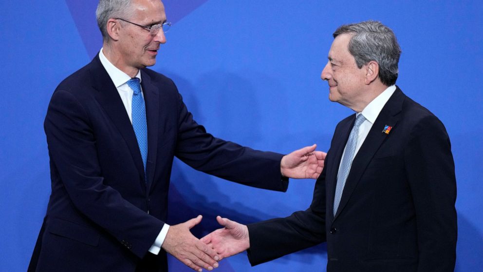 NATO Secretary General Jens Stoltenberg, left, shakes hands with Italian Prime Minister Mario Draghi at the official arrivals for the NATO summit in Madrid, Spain, on Wednesday, June 29, 2022. North Atlantic Treaty Organization heads of state will me