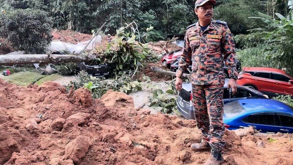 This photo released by Korporat JBPM, a rescue worker in an operation following a landslide at a campsite in Batang Kali, Selangor state, on the outskirts of Kuala Lumpur, Malaysia, Dec. 16, 2022. A landslide early Friday at a hillside tourist campgr