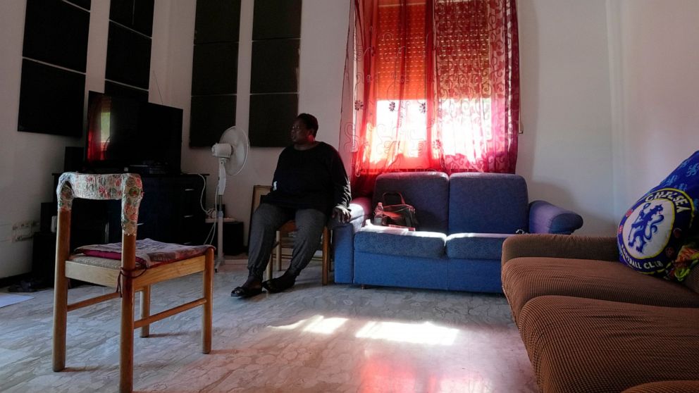 Charity Oriakhi, widow of a street vendor Alika Ogochukwu, sits at her home at the end of an interview with Associated Press, in San Severino Marche, Italy, Friday, Aug. 5, 2022. The brutal killing of a Nigerian immigrant in broad daylight has sparke
