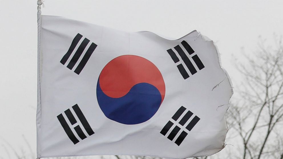 FILE - A national flag flutters at the Imjingak Pavilion in Paju, South Korea on April 22, 2020. The rival Koreas exchanged warning shots along their disputed western sea boundary on Monday, Oct. 24, 2022, their militaries said, amid heightened animo