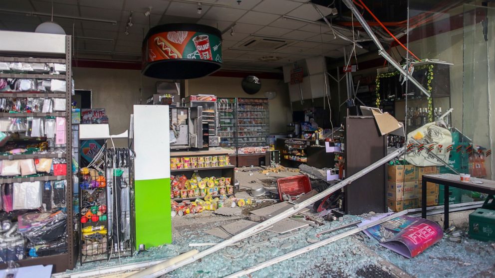 Debris are scattered on the floor of a damaged store a day after a strong quake struck in Digos, Davao del Sur province, southern Philippines Thursday, Oct. 17, 2019. A powerful and shallow earthquake hit several southern Philippine provinces Wednesd