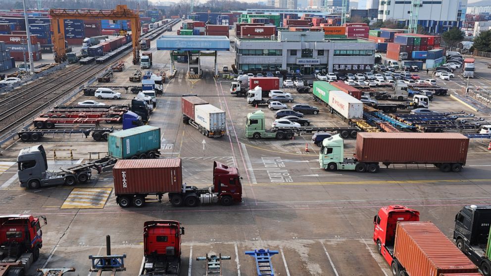 Container trucks run at the Inland Container Depot in Uiwang, a logistics hub, South Korea, Friday, Dec. 9, 2022. (Hong Ki-won/Yonhap via AP)