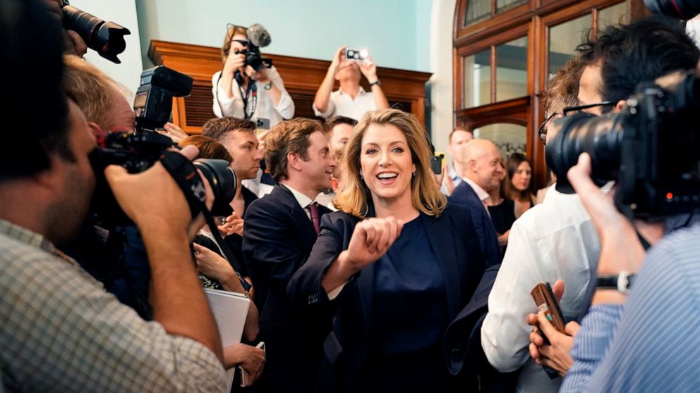 British Member of Parliament Penny Mordaunt, centre, reacts, at the launch of her campaign to be Conservative Party leader and Prime Minister, at the Cinnamon Club, in Westminster, London, Wednesday July 13, 2022. Conservative Party lawmakers in Brit