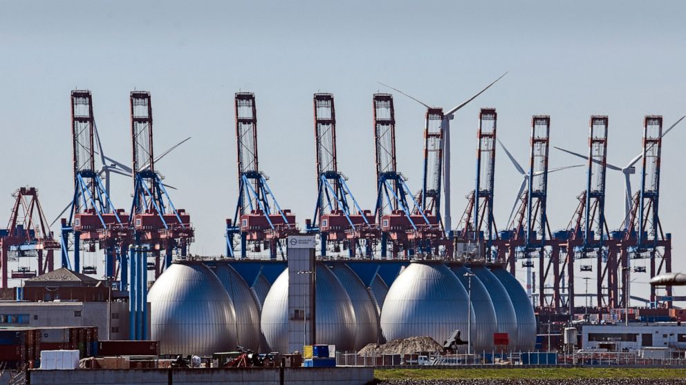 FILE - Tanks for producing bio gas are pictured at the harbor in Hamburg, Germany, on April 19, 2022. Germany says it’s making progress on weaning itself off Russian fossil fuels and expects to be fully independent of crude oil imports from Russia by