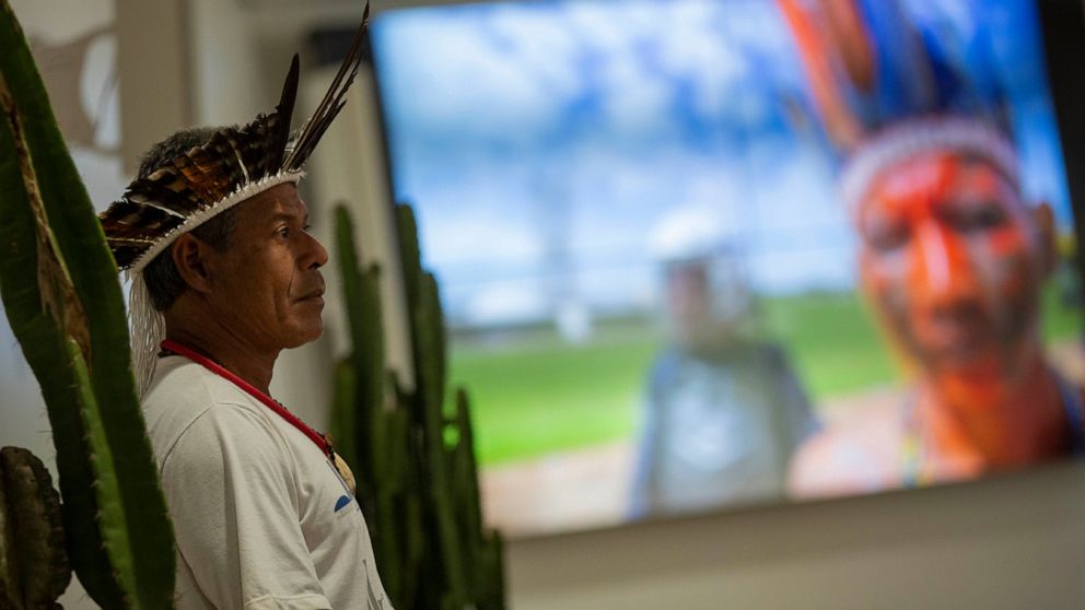A Pataxo indigenous man attends the launch of the report on violence against indigenous peoples in Brazil, at the headquarters of the National Conference of Bishops in Brasilia, Brazil, Tuesday, Sept. 24, 2019. A Brazilian Catholic Church agency says
