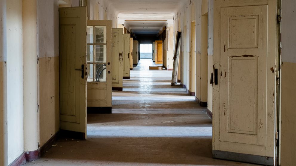 In this Tuesday, Feb. 22, 2019 photo, the doors stand open in a corridor of the abandoned "Haus der Offiziere", the headquarters for the Soviets' military high command in former East Germany at the Wuensdorf neighborhood of Zossen, some 40 kilometers