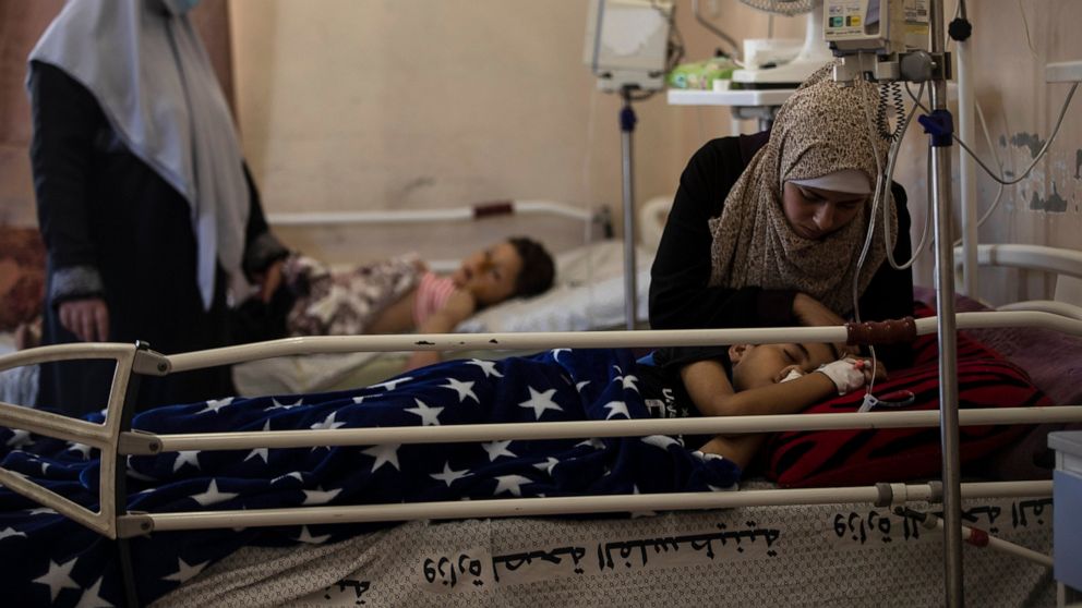 Beset by virus, Gaza's hospitals now struggle with wounded