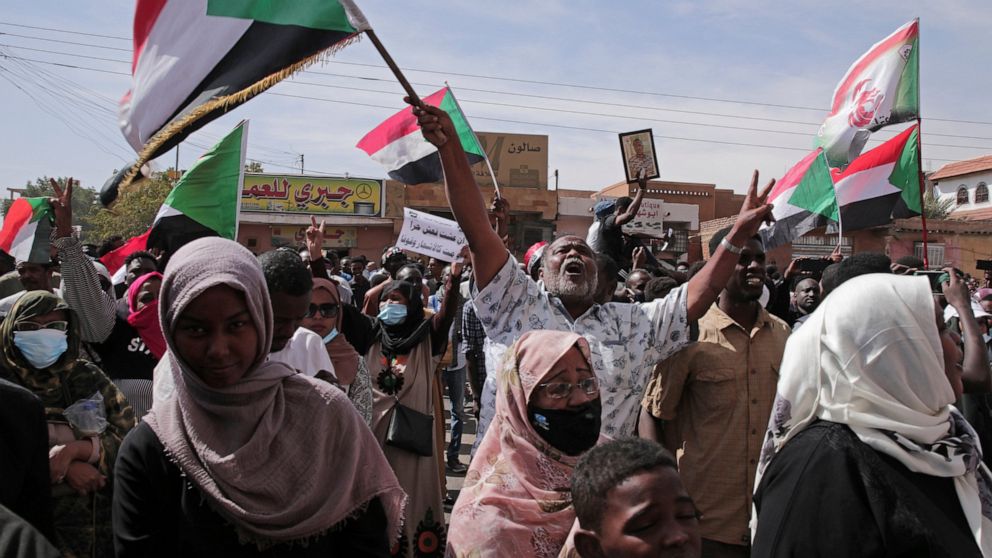 People chant slogans during a protest to denounce the October 2021 military coup, in Khartoum, Sudan, Sunday, Jan. 2, 2022. Sudanese security forces fired tear gas Sunday to disperse protesters as thousands rallied against military rule, medics said.