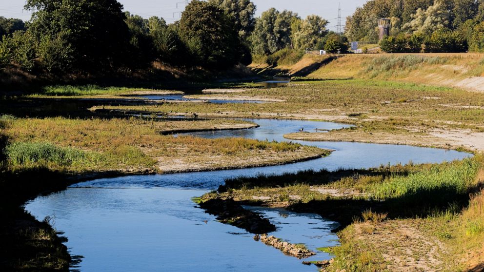 The sun shines on the river 'Emscher' in Castrop-Rauxel, western Germany, Thursday, Sept. 1, 2022. German Chancellor Olaf Scholz celebrated the river’s revival Thursday, hailing the 30-year effort to rewild the Emscher as an example perseverance that