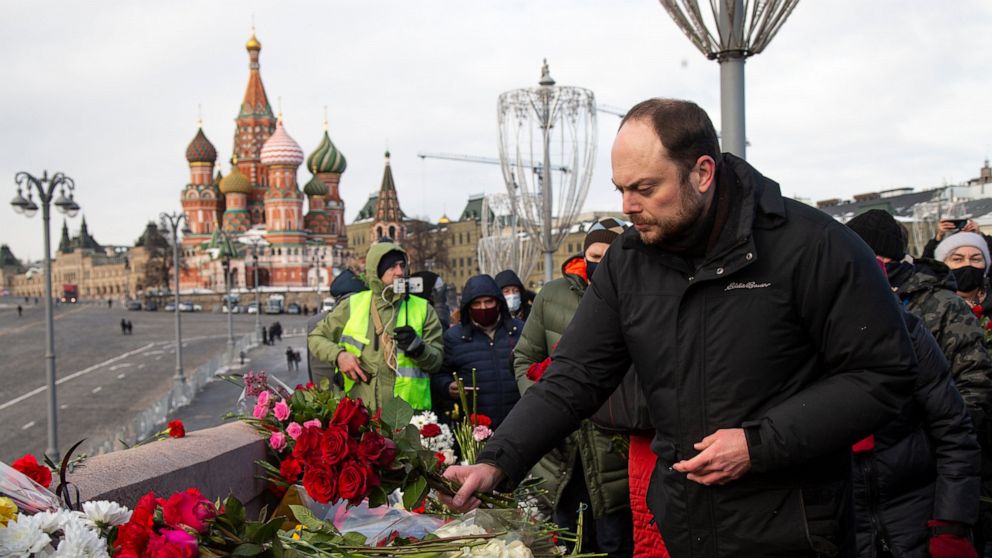 The Russians lay flowers to mark the killing of the opposition leader