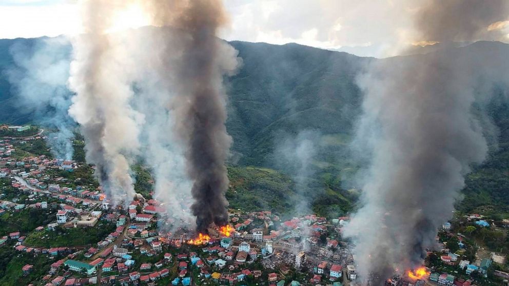 In this photo released by the Chin Human Rights Organization, fires burn in the town of Thantlang in Myanmar's northwestern state of Chin, on Friday Oct. 29, 2021. More than 160 buildings in the town in the northwestern Myanmar, including three churc