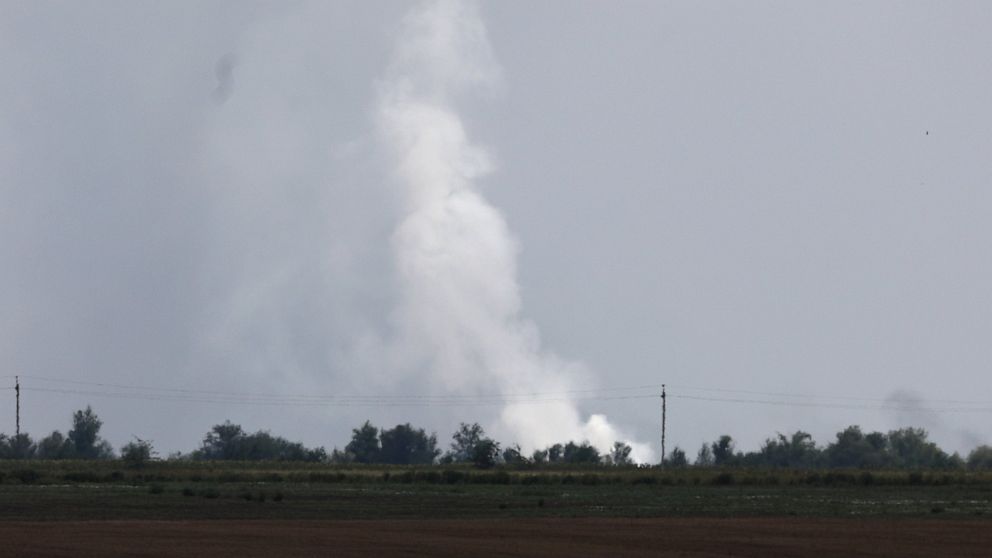 Smoke rises over the site of explosion at an ammunition storage of Russian army near the village of Mayskoye, Crimea, Tuesday, Aug. 16, 2022. Explosions and fires ripped through an ammunition depot in Russian-occupied Crimea on Tuesday in the second 