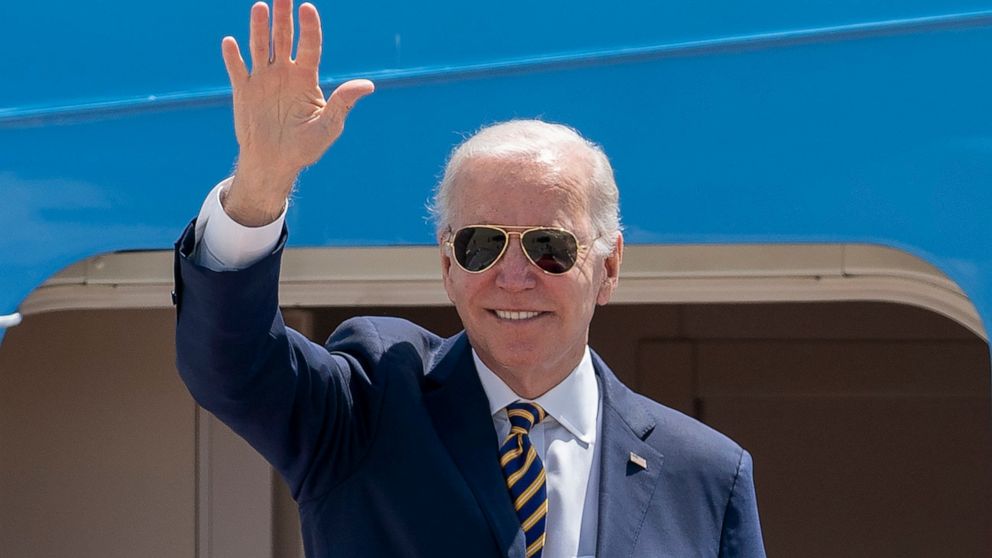 FILE - President Joe Biden waves as he boards Air Force One for a trip to South Korea and Japan, on May 19, 2022, at Andrews Air Force Base, Md. China is holding military exercises in the disputed South China Sea coinciding with U.S. President Joe Bi