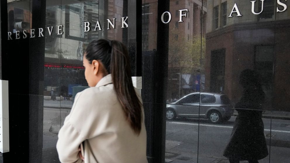 A woman walks past the Reserve Bank of Australia in Sydney, Tuesday, Sept. 6, 2022. Australia's central bank boosted its benchmark interest rate for a fifth consecutive month to a seven-year high of 2.35%. (AP Photo/Rick Rycroft)