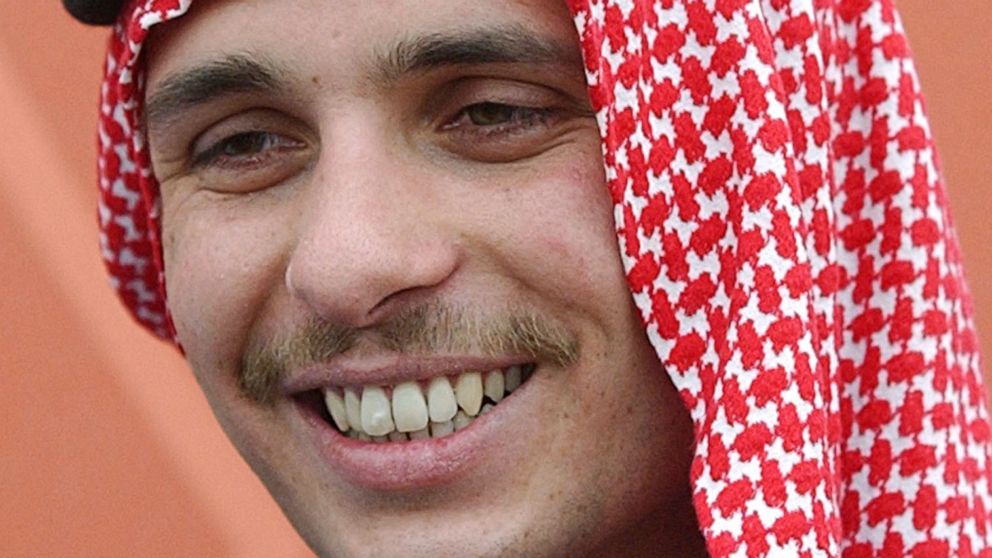 FILE - Jordan's Crown Prince Hamzah smiles during a royal lunch hosted for tribesmen at the Royal Palace compound in Amman, Jordan in this May 26, 2004, file photo. The royal court in Jordan said Tuesday, March 8, 2022, that the half-brother of King 