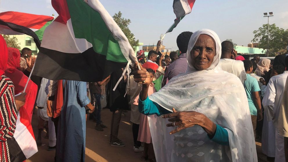Sudanese people celebrate in the streets of Khartoum after ruling generals and protest leaders announced they have reached an agreement on the disputed issue of a new governing body on Friday, July 5, 2019. The deal raised hopes it will end a three-m