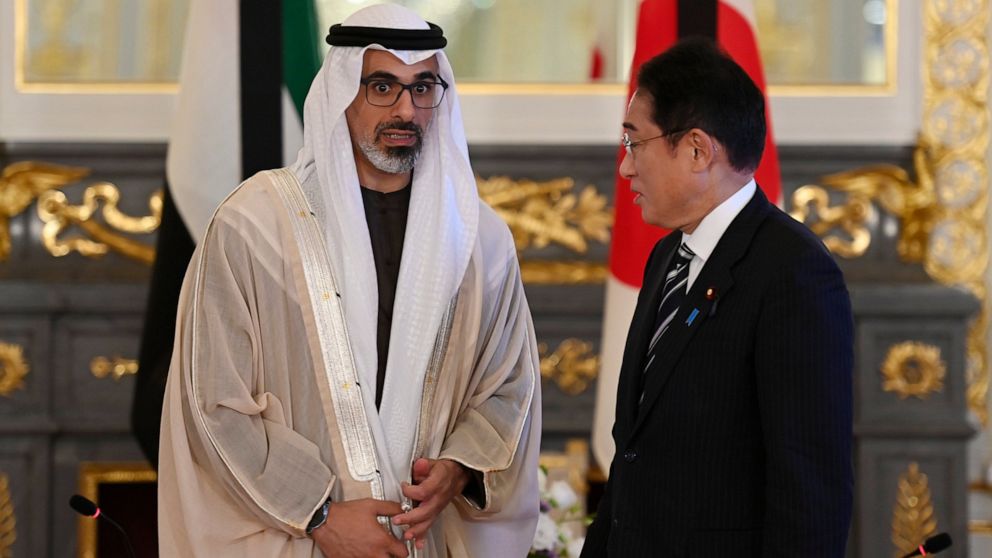 Japan's Prime Minister Fumio Kishida, right, and Sheikh Khaled bin Mohamed bin Zayed Al Nahyan, member of Abu Dhabi Executive Council and chairman of Abu Dhabi Executive Office, pose for the photographers prior to their bilateral meeting at Akasaka P