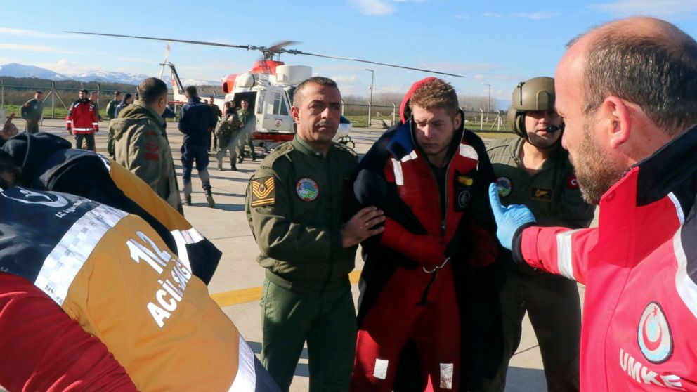 Turkish coast guard and a medic help a crew member after a Panama-flagged vessel, Volgo Balt 214, which sank in rough waters off the Black Sea coastal province of Samsun, Turkey, Monday, Jan. 7, 2019. A cargo ship sank in rough waters off Turkey’s Bl
