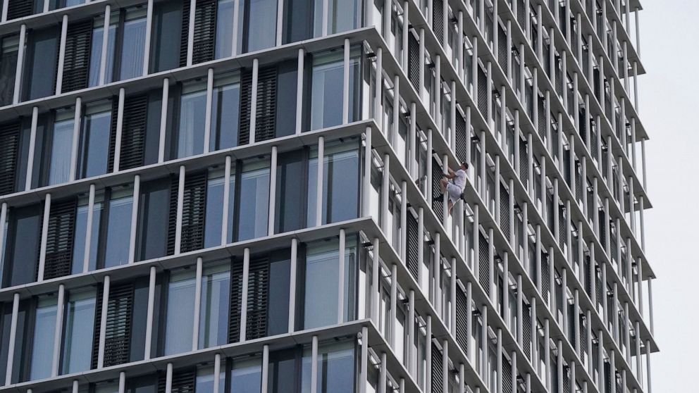 Free climber scales London skyscraper in climate stunt