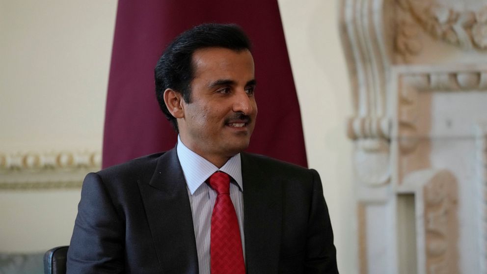 FILE - The Amir of Qatar Sheikh Tamim bin Hamad Al Thani listens to British Prime Minister Boris Johnson at the start of their meeting inside 10 Downing Street, in London, Tuesday, May 24, 2022. Qatar’s emir arrived in Cairo late Friday, June 24, to 