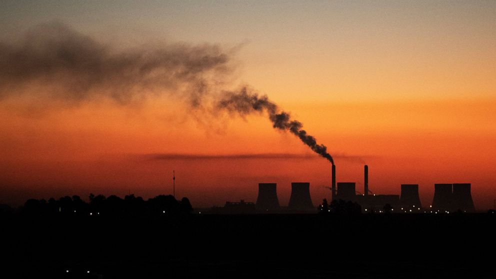 FILE - A coal-fired power station in Witbank, South Africa , Monday, Oct. 11, 2021. South Africans are struggling in the dark to cope with increased power cuts that have hit households and businesses across the country. The rolling power cuts have be