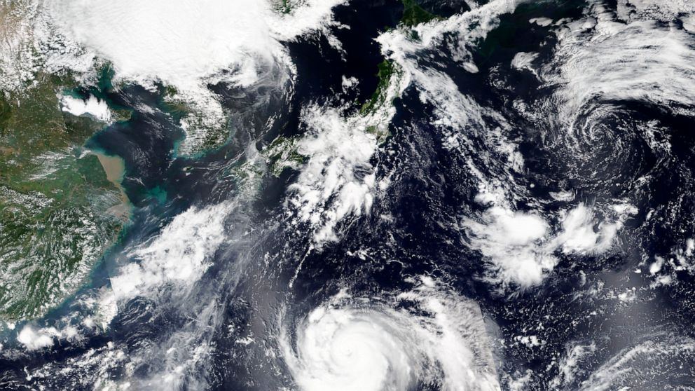 This Thursday, Sept. 3, 2020, satellite image released by NASA Worldview, Earth Observing System Data and Information System (EOSDIS) shows tropical storm Haishen, lower center, sweeping northward. Haishen could gain in ferocity before slamming into 