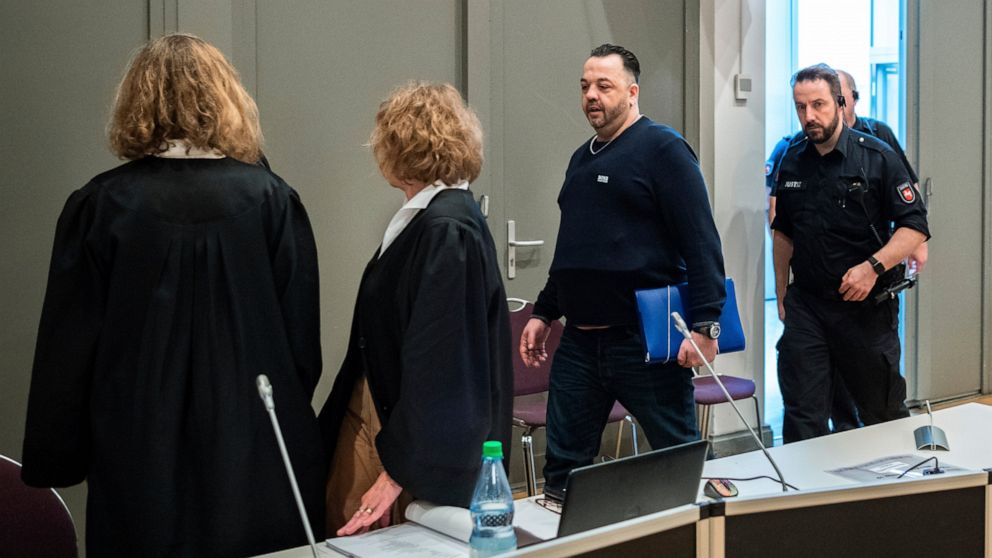 Former nurse Niels Hoegel, 3rd left, accused of multiple murder and attempted murder of patients, arrives for a session of the district court in Oldenburg, Germany, Wednesday, June 5, 2019. (Mohssen Assanimoghaddam/dpa via AP, Pool)