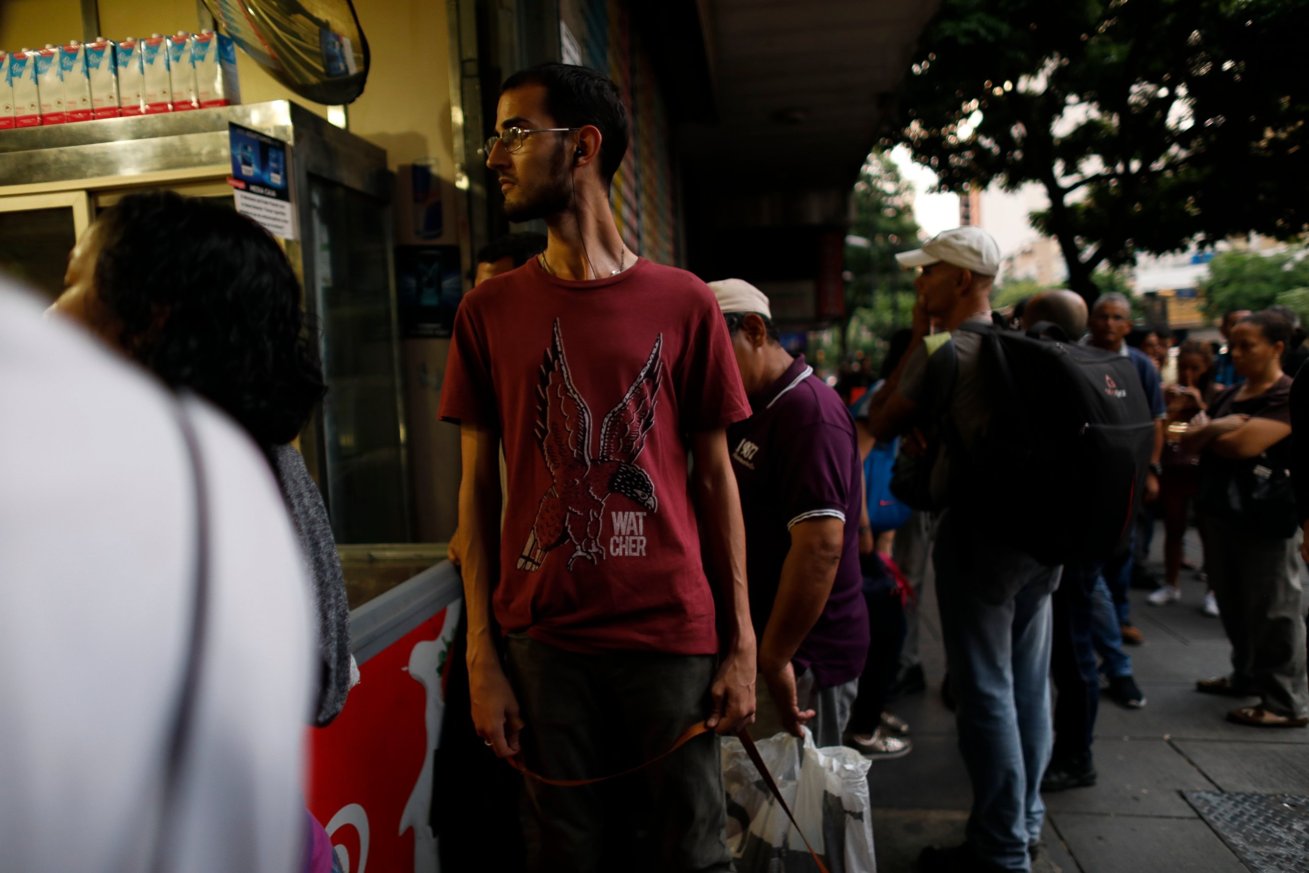 People walk in the streets of Caracas after a massive blackout left the city and other parts of the country without electricity, in Caracas Venezuela, Monday, July 22, 2019. The power in the capital went out around 4:30 p.m. (2030 GMT) and immediatel