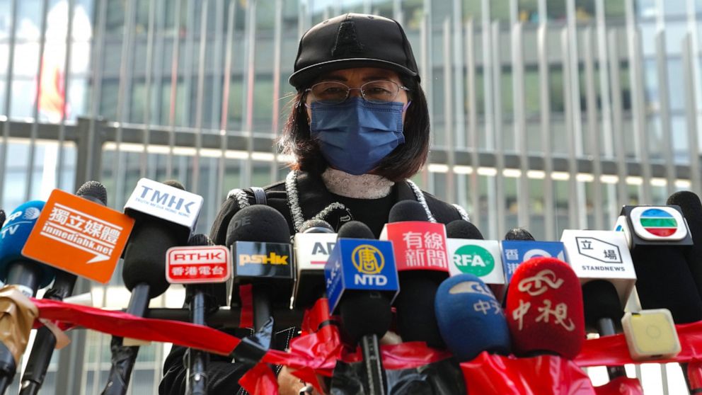 Mrs. Poon, the mother of a young woman killed in Taiwan, speaks to the media outside the government headquarters in Hong Kong, Wednesday, Oct. 20, 2021. Mrs. Poon, whose daughter Poon Hiu-wing was killed while visiting Taiwan in 2018, has lambasted H